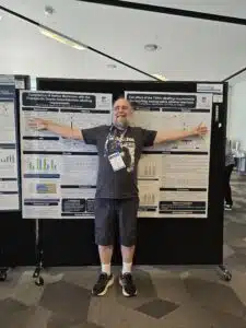 Photographer extraordinaire Dr Ian Musgrave taking time out from behind the camera to present his research from The University of Adelaide during one of the poster sessions.